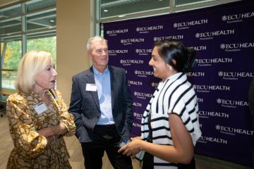 Scholarship donors Kathy and Linwood Brown with scholarship student Hiral Patel at the annual ECU Health Foundation Scholarship Luncheon at Eastern AHEC on Nov. 7, 2025.